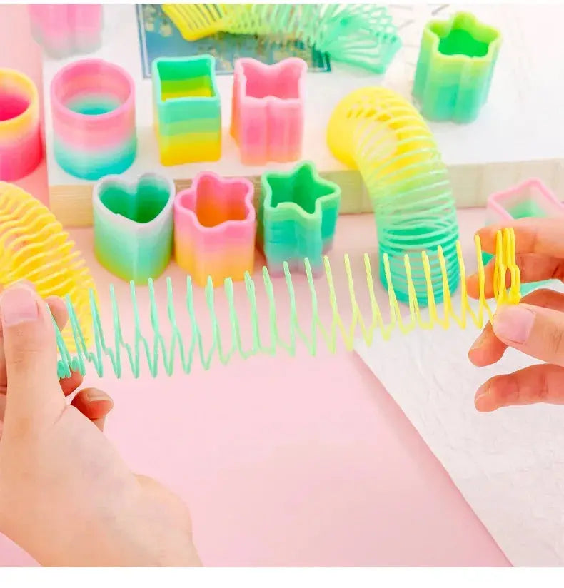 10Pcs Mini Plastic Rainbow Neon Magic Spring Toys for Kids Birthday Party Favors Baby Shower Christmas Party Gifts Pinata Filler Shopbizz Wholesale